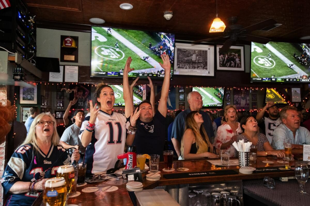 Fanatics cheering on a game