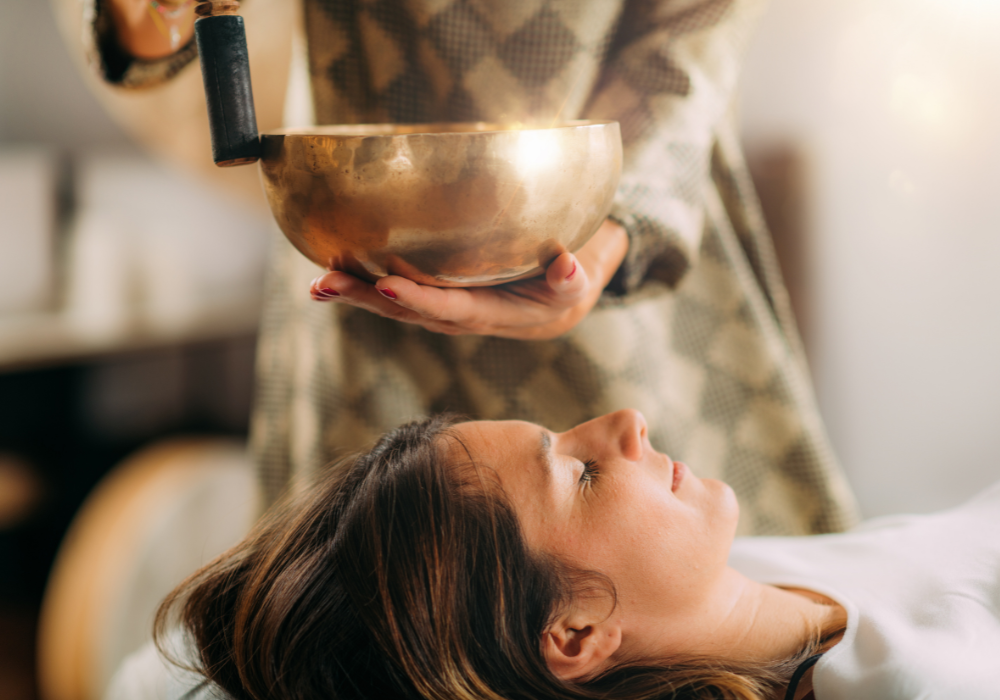 A woman receiving sound therapy