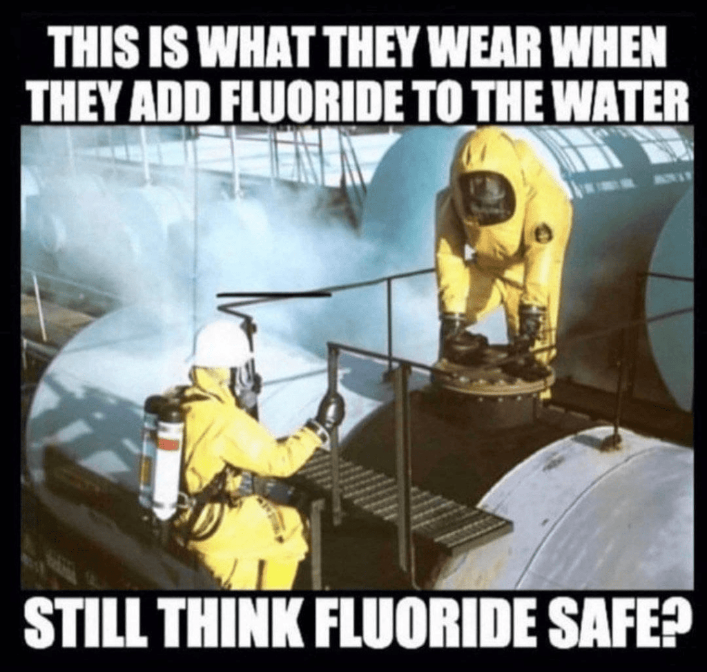 Workers in hazmat suits adding fluoride to the water