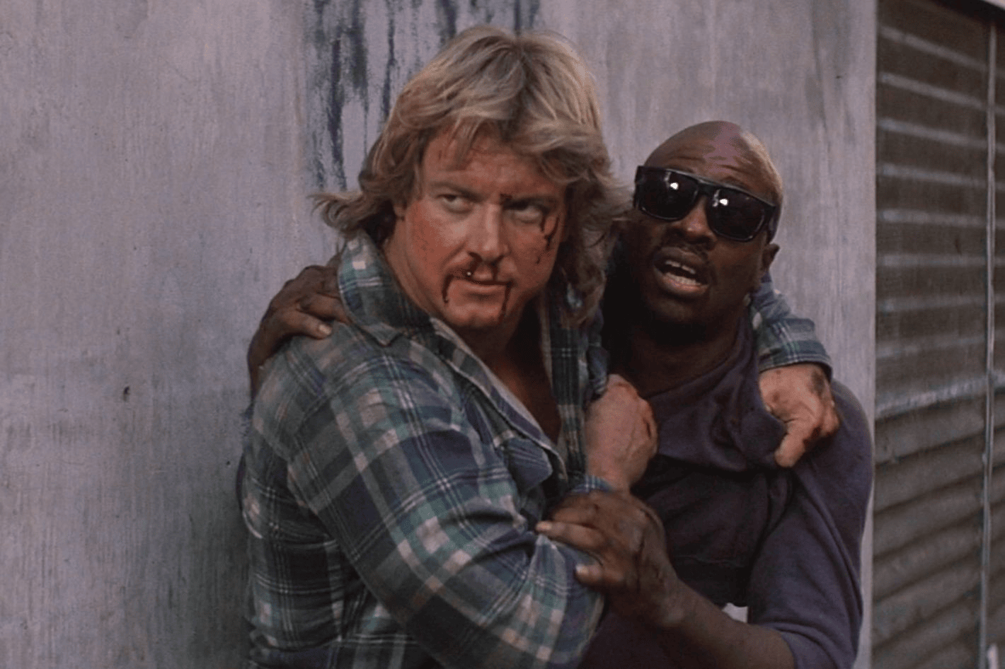 Roddy Piper (Nada) and Keith David (Frank) in They Live.

